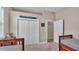 Neutral ' bedroom featuring bi-fold closet doors and space for furnishings at 3121 Highlands By The Lake Way, Lakeland, FL 33812