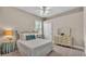 Cozy bedroom featuring a ceiling fan, a double bed, and a classic vanity with mirror at 3121 Highlands By The Lake Way, Lakeland, FL 33812