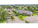 Exterior shot of the neighborhood clubhouse and tennis court at 3121 Highlands By The Lake Way, Lakeland, FL 33812