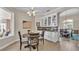 Bright dining room features wood floors, table with seating for four, and built-in cabinets at 3121 Highlands By The Lake Way, Lakeland, FL 33812