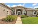 Attractive home with a manicured lawn and a welcoming entrance with stone walkway at 3121 Highlands By The Lake Way, Lakeland, FL 33812