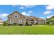 Charming single-Gathering home featuring a well-manicured lawn and beautiful landscaping at 3121 Highlands By The Lake Way, Lakeland, FL 33812