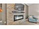 Modern fireplace features tile surround, mounted TV and contemporary style at 3121 Highlands By The Lake Way, Lakeland, FL 33812