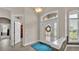 Bright foyer featuring a decorative glass door and a blue rug on a light-colored floor at 3121 Highlands By The Lake Way, Lakeland, FL 33812