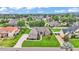Beautifully landscaped front yard with a well-manicured lawn and decorative shrubs, accentuating the home's curb appeal at 3121 Highlands By The Lake Way, Lakeland, FL 33812