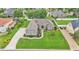 Well-maintained front yard featuring lush green grass and tasteful landscaping, highlighting the home's exterior at 3121 Highlands By The Lake Way, Lakeland, FL 33812