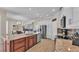 Spacious kitchen island with bar seating, stainless appliances, and view to breakfast nook at 3121 Highlands By The Lake Way, Lakeland, FL 33812
