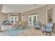 Covered lanai with comfortable seating and ceiling fans, ideal for year-round outdoor enjoyment at 3121 Highlands By The Lake Way, Lakeland, FL 33812