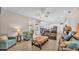Spacious living room shows open concept, modern furniture, and lots of light at 3121 Highlands By The Lake Way, Lakeland, FL 33812
