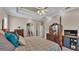 Spacious main bedroom featuring a tray ceiling, fan and stylish furnishings and decor at 3121 Highlands By The Lake Way, Lakeland, FL 33812