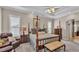 Comfortable main bedroom with four poster bed and bright lighting at 3121 Highlands By The Lake Way, Lakeland, FL 33812