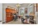 Home office with custom wood built-ins, desk, and comfortable leather chair with natural light at 3121 Highlands By The Lake Way, Lakeland, FL 33812