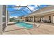 The outdoor living space includes a screened-in pool, patio and outdoor seating, perfect for relaxation and entertaining at 3121 Highlands By The Lake Way, Lakeland, FL 33812