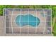 Overhead shot of the pool featuring a screened enclosure, tiled patio, and backyard greenery at 3121 Highlands By The Lake Way, Lakeland, FL 33812