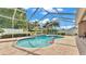 Inviting screened pool with brick pavers and lush landscaping, perfect for relaxing and entertaining outdoors at 3121 Highlands By The Lake Way, Lakeland, FL 33812