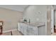 This wet bar includes a sink, counter, cabinets, mini refrigerator, and microwave, adding convenience and functionality to the space at 3121 Highlands By The Lake Way, Lakeland, FL 33812