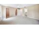 Spacious main bedroom with neutral walls, plush carpeting, and multiple closets for ample storage at 5 Pine Run, Haines City, FL 33844