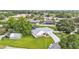 Overhead aerial of the home displaying the roof, driveway, an attached two-car garage, and the surrounding landscape at 535 N Todhunter Way, Lake Alfred, FL 33850