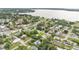 Picturesque aerial view showing the neighborhood and the scenic lake views beyond the established and serene community at 535 N Todhunter Way, Lake Alfred, FL 33850