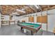 Finished basement area with exposed ceiling, pool table, and other amenities at 535 N Todhunter Way, Lake Alfred, FL 33850