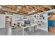 Basement with exposed ceiling, grey floor, shelving and workspace at 535 N Todhunter Way, Lake Alfred, FL 33850