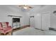 Bedroom with wood floors features a ceiling fan and closet at 535 N Todhunter Way, Lake Alfred, FL 33850
