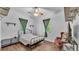 Charming bedroom featuring natural light, plank flooring, and a ceiling fan at 535 N Todhunter Way, Lake Alfred, FL 33850