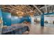 Spacious bedroom with exposed ceiling, hardwood floors, blue walls and chandelier lighting at 535 N Todhunter Way, Lake Alfred, FL 33850