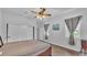 Bedroom featuring ceiling fan, natural light from the window and a closet at 535 N Todhunter Way, Lake Alfred, FL 33850