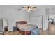 Bedroom with ceiling fan, closet and view of the breakfast nook at 535 N Todhunter Way, Lake Alfred, FL 33850