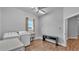 Bright laundry room with modern appliances, utility sink, wood-look floors and access door to hall at 535 N Todhunter Way, Lake Alfred, FL 33850