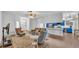 Open-concept living room with hardwood floors, comfortable seating, and modern decor at 535 N Todhunter Way, Lake Alfred, FL 33850