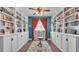 Stunning home library featuring built-in bookshelves with wood floors and natural light at 535 N Todhunter Way, Lake Alfred, FL 33850