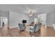 Bright and airy living room with hardwood floors and an open concept design at 535 N Todhunter Way, Lake Alfred, FL 33850