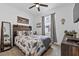 Comfortable bedroom features a decorative wood headboard and eye-catching Southwest style decor at 546 Scott Lake Creek Ln, Lakeland, FL 33813