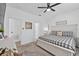 Inviting bedroom features a queen bed, a dresser, and two entryways at 546 Scott Lake Creek Ln, Lakeland, FL 33813