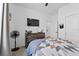 Comfortable bedroom features a mounted TV above a wooden dresser and cozy decor at 546 Scott Lake Creek Ln, Lakeland, FL 33813