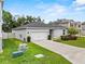 Charming single story home with well-manicured lawn and long driveway at 546 Scott Lake Creek Ln, Lakeland, FL 33813