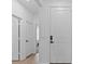 Neutral hallway with various doors at 546 Scott Lake Creek Ln, Lakeland, FL 33813