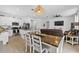 Open-concept kitchen with stainless steel appliances flows into the dining and living area at 546 Scott Lake Creek Ln, Lakeland, FL 33813