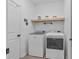 Functional laundry room equipped with modern washer and dryer units at 546 Scott Lake Creek Ln, Lakeland, FL 33813