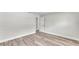 Spacious bedroom with modern wood-look floors and neutral paint at 6 Rosewood Dr, Davenport, FL 33837