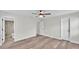 Spacious bedroom with wood-look flooring, ceiling fan, and ensuite bathroom access at 6 Rosewood Dr, Davenport, FL 33837