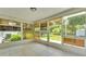 Enclosed lanai featuring tiled floor, large windows offering views of the backyard at 6 Rosewood Dr, Davenport, FL 33837