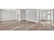 Inviting living area featuring modern flooring and open floor plan to dining and kitchen at 6 Rosewood Dr, Davenport, FL 33837