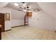 Spacious, carpeted attic with ceiling fan, and bonus storage cabinetry at 6001 Sweet Gum Run, Bartow, FL 33830