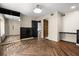 Bright bedroom with wood floors, a large window, and a modern dresser at 6001 Sweet Gum Run, Bartow, FL 33830