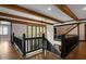 Open foyer featuring hardwood floors, stairs to the second level, and natural light from windows at 6001 Sweet Gum Run, Bartow, FL 33830