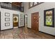 Grand foyer with high ceilings, hardwood floors, and a staircase leading to the second floor at 6001 Sweet Gum Run, Bartow, FL 33830