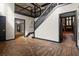 Spacious foyer with hardwood floors, a staircase, and views into the living room at 6001 Sweet Gum Run, Bartow, FL 33830